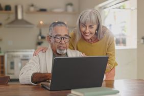 Older couple with computer