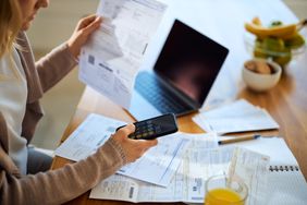 A person paying bills