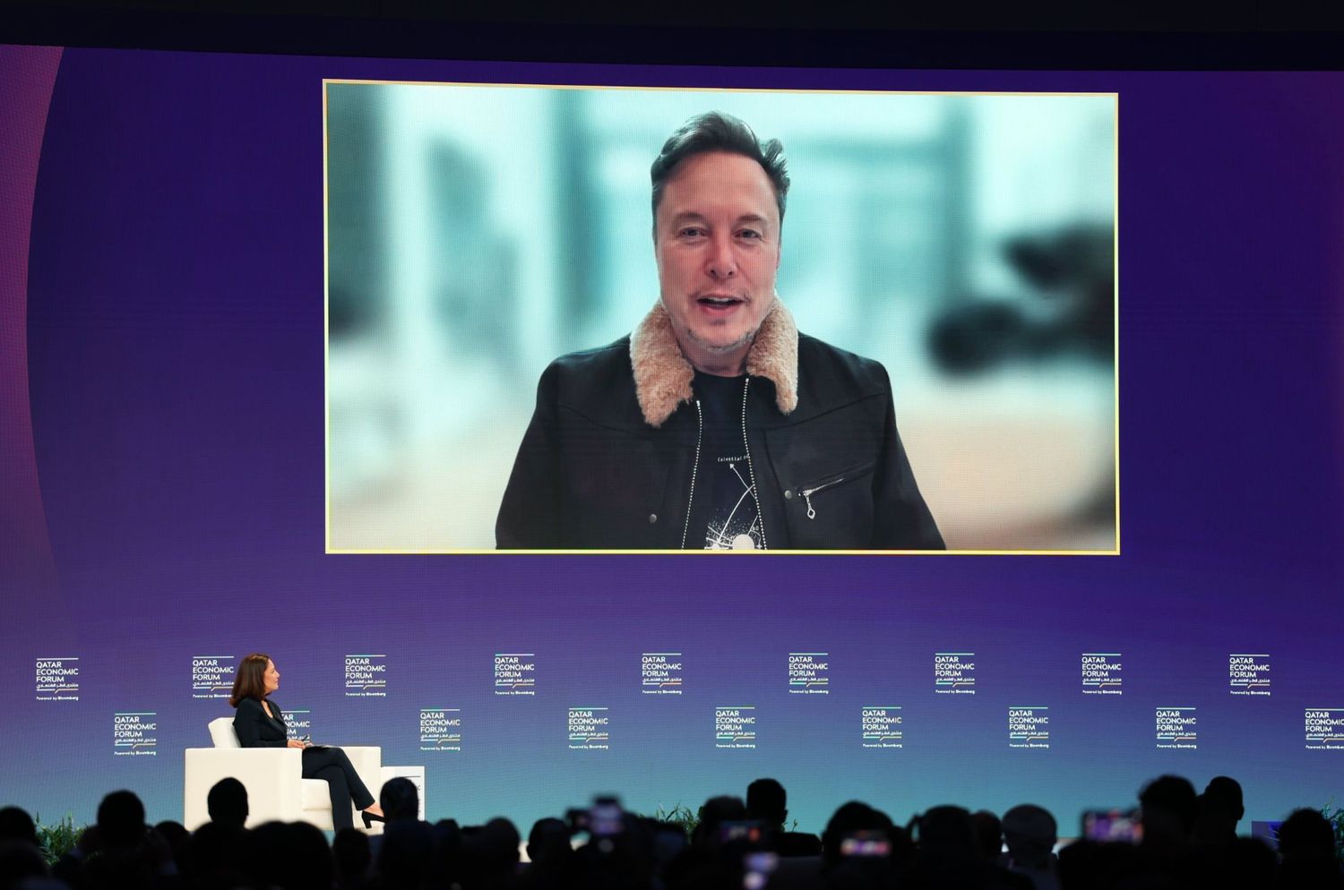 Elon MusK, chief executive officer of Tesla Inc., speaks via video link at the Qatar Economic Forum (QEF) in Doha, Qatar, on Tuesday, May 20, 2025. 