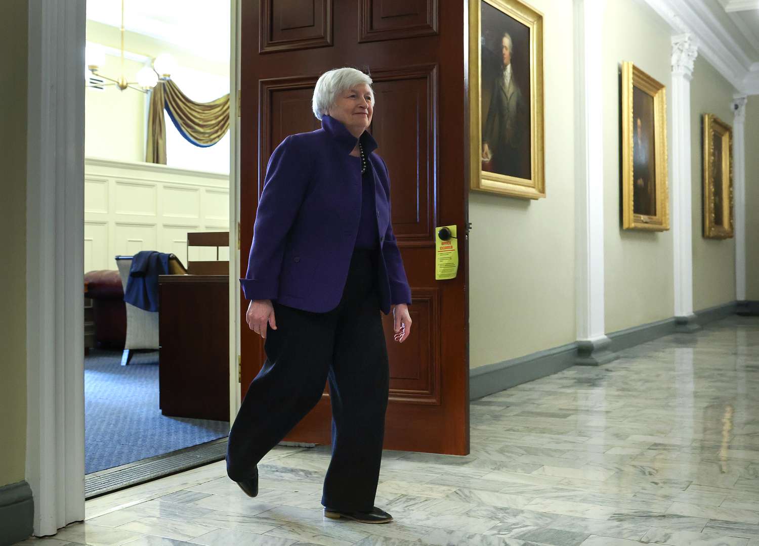Treasury Secretary Janet Yellen walking out of a room.