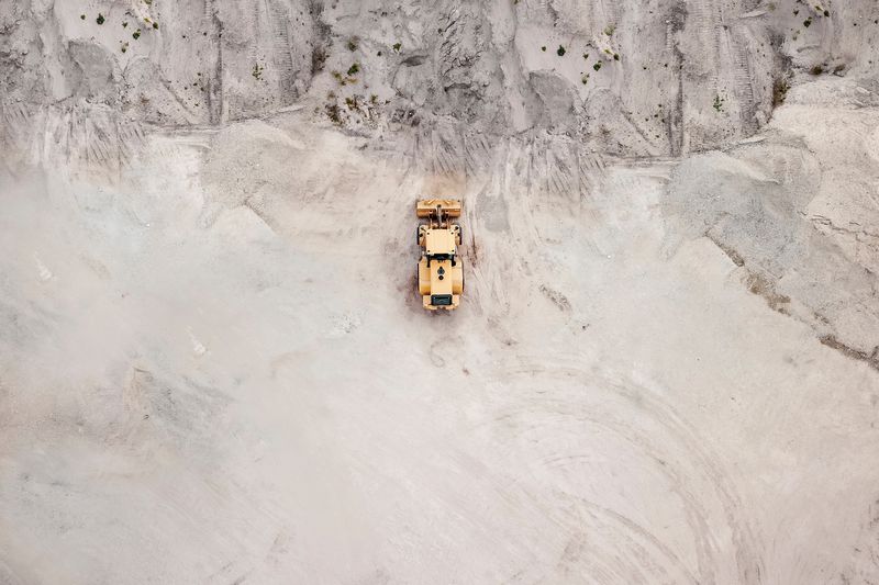 Aerial View Of Bulldozer On Sand
