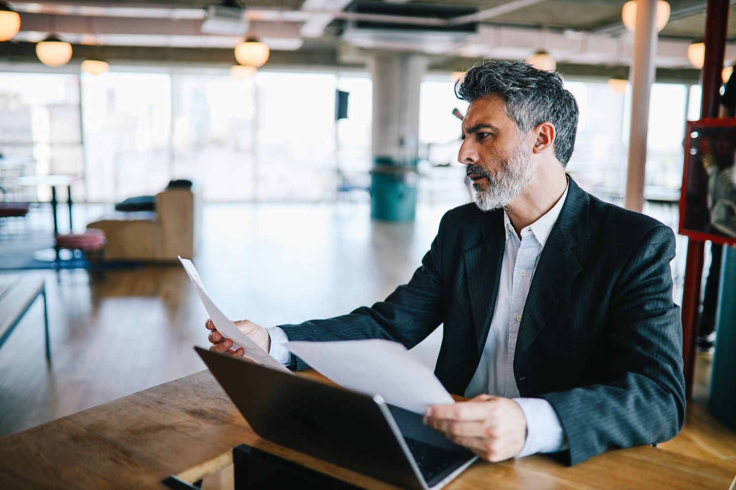 A shareholder examines dividend statements received during the year to file their income tax.