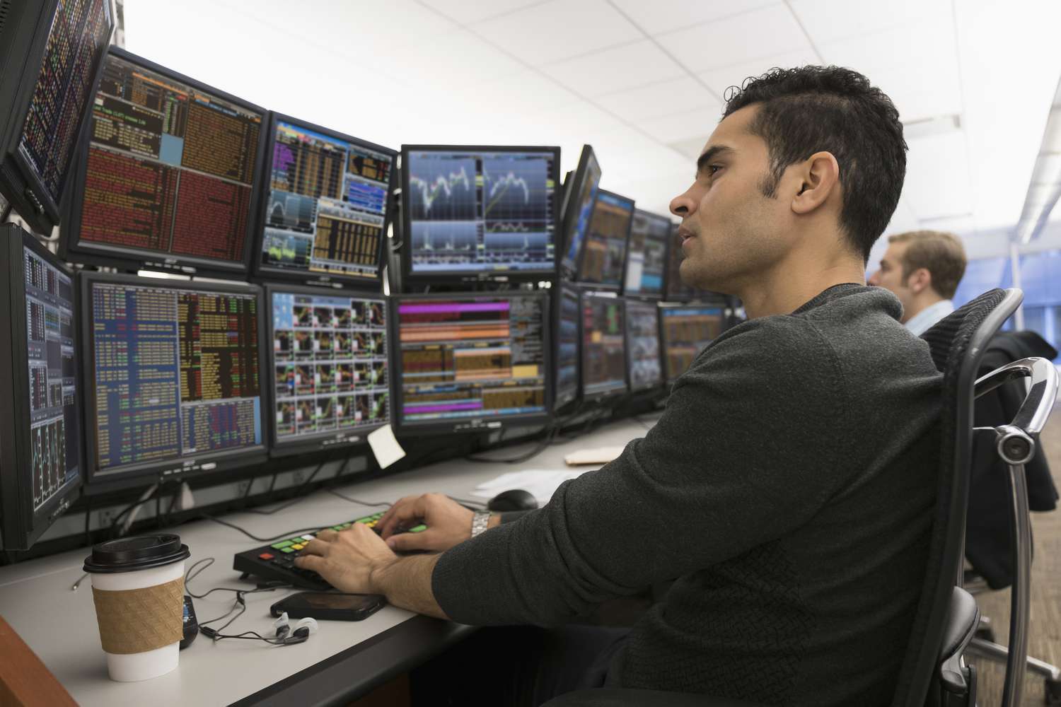 Young traders analyzing computer data
