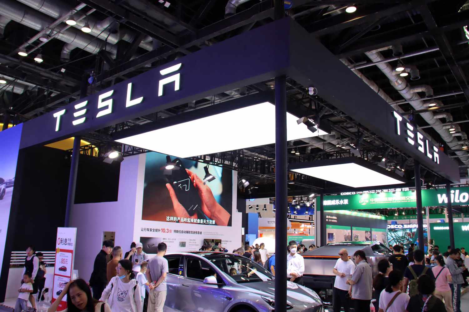Visitors visit the booth of Tesla at the 2024 China Beijing International Fair for Trade in Services (CIFTIS) in Beijing, China, September 16, 2024. 