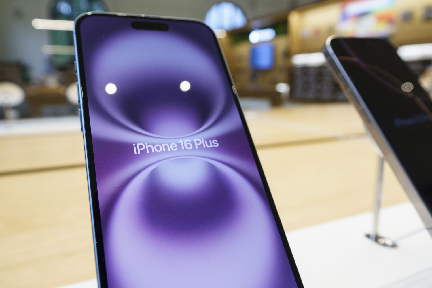 An iPhone 16 Plus is seen on a display inside a store in Washington, DC.