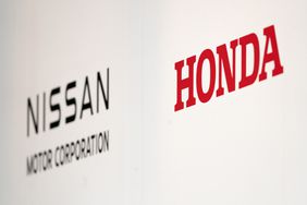 The Nissan and Honda logos at an event in Tokyo in December. 