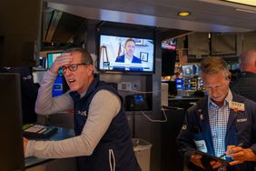 Traders work on the floor of the New York Stock Exchange.