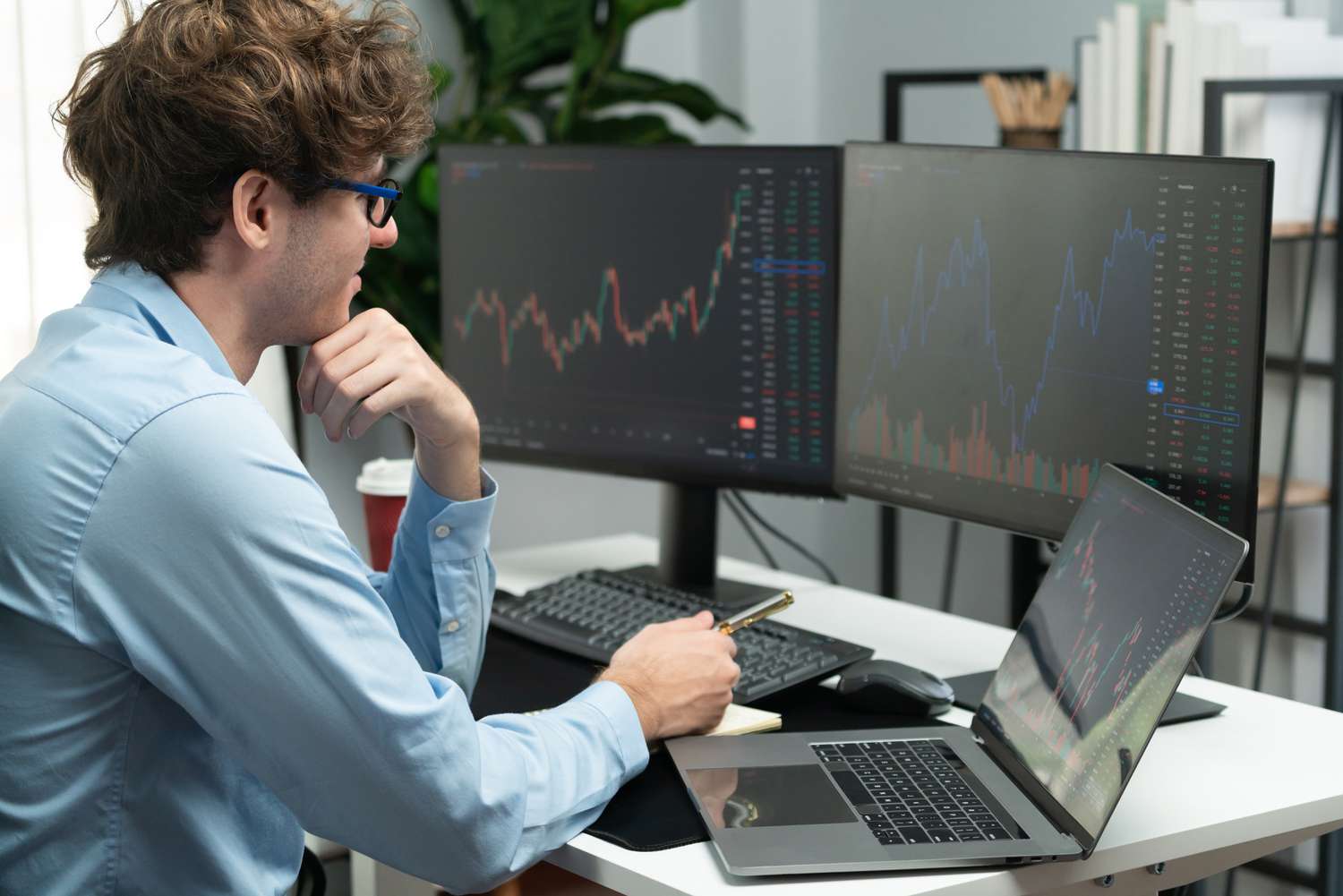A trader looks at their computer monitor and grins as they see the price of a stock rise sharply after it is included in the S&P.