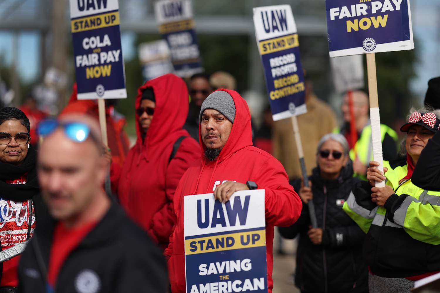 United Auto Workers members picket amid the union's strike.