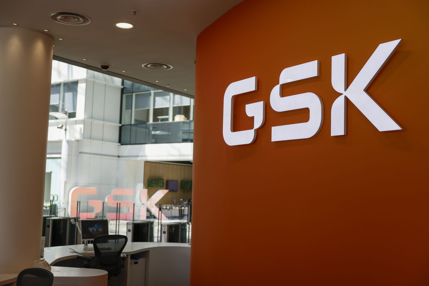 Signage for GSK Plc displayed at the company's headquarters in the Brentford suburb of London, UK, on April 30, 2024