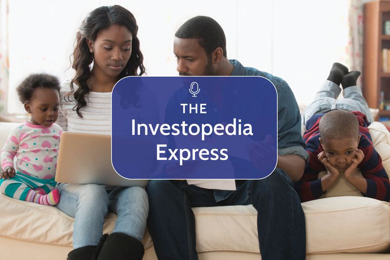 African American family sitting on the couch with a laptop discussing finances
