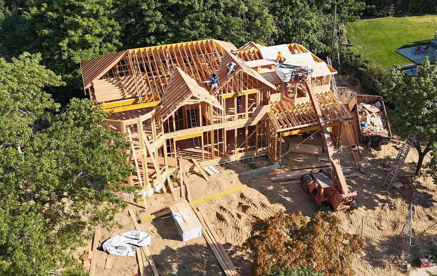 Builders work on new house construction on September 03, 2024 in Old Bethpage, New York.
