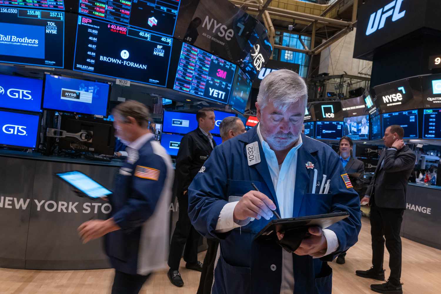 Traders work on the New York Stock Exchange 