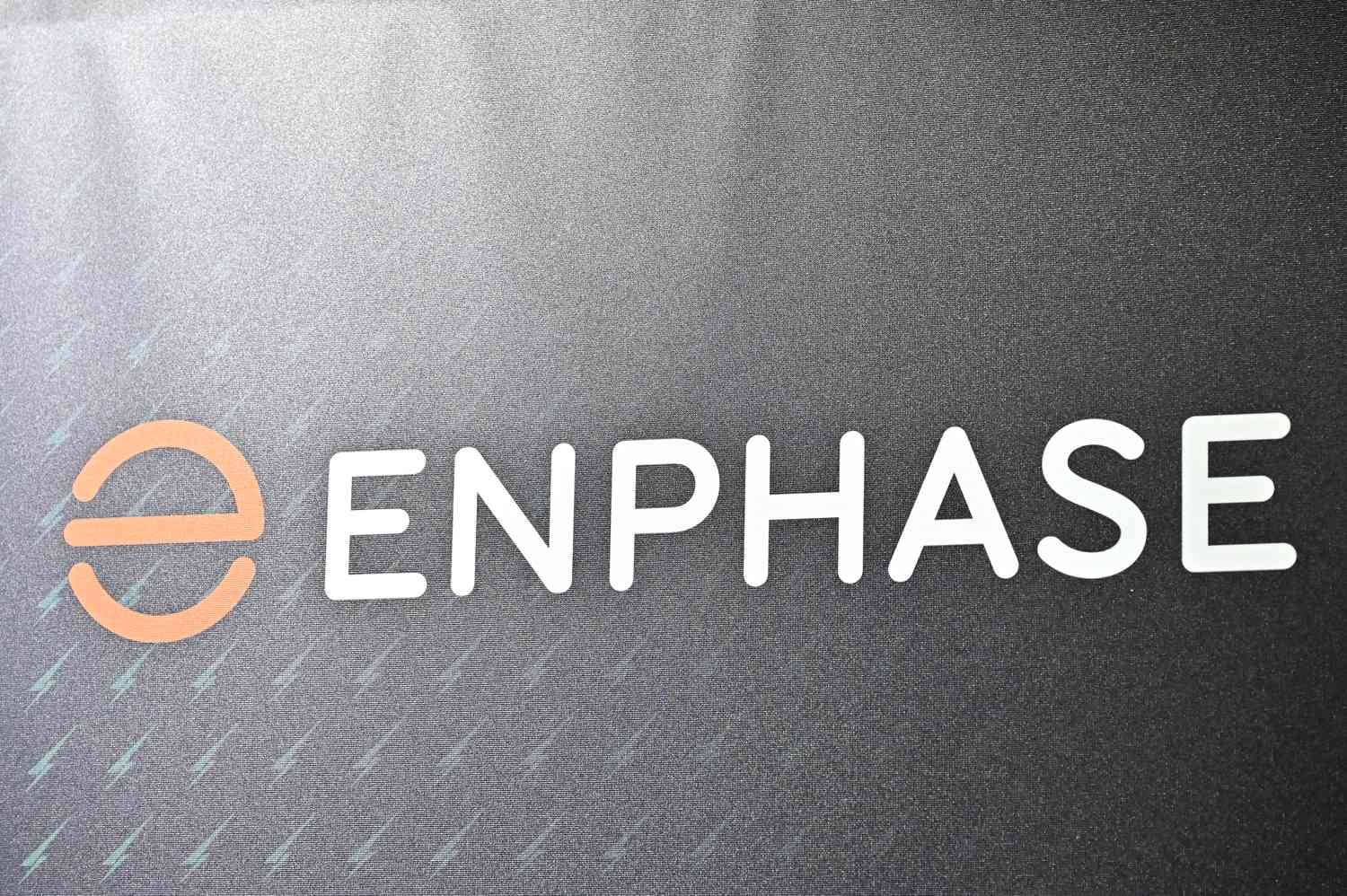 The Enphase domestic home EV electric Vehicle charger company logo branding is displayed during the Everything Electric London 2024 at ExCel on March 28, 2024 in London, England