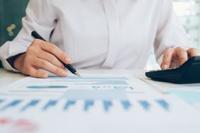 A businessman analyze investment marketing data.