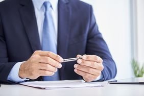 A man holding a pen
