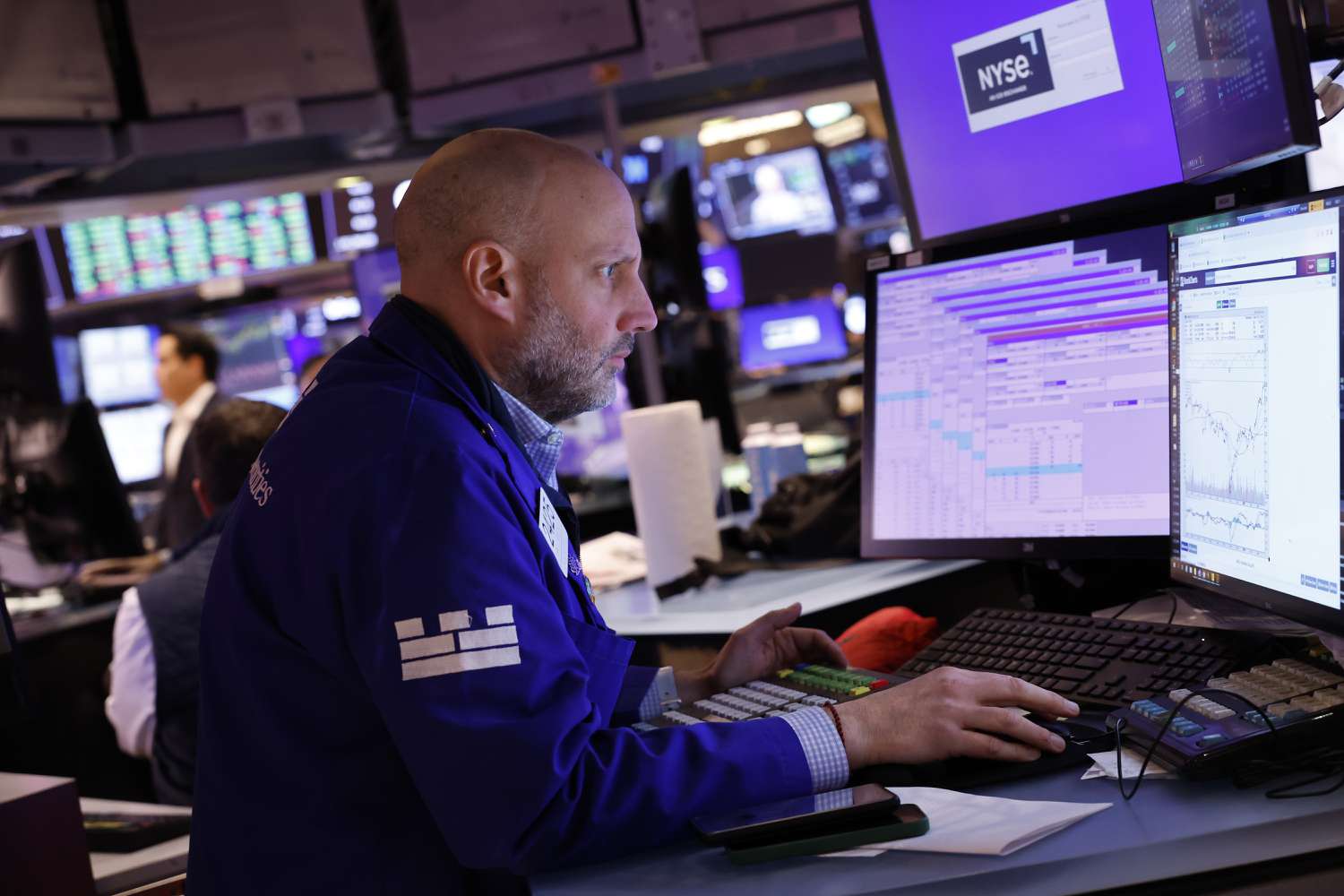 Traders work on the floor of the New York Stock Exchange.