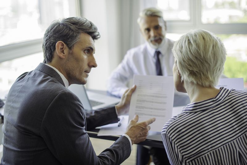 Businessman Meeting With Couple