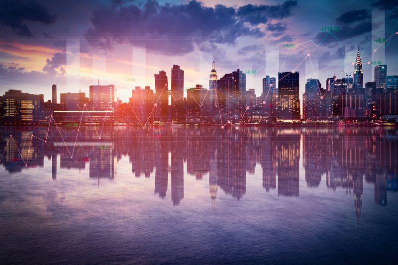Business background with stock graph growth on the city skyline view.