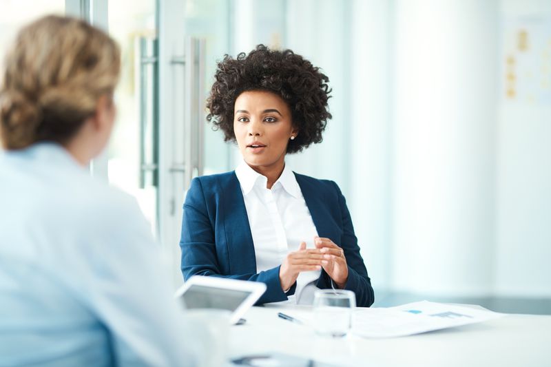 Financial broker talking with a client