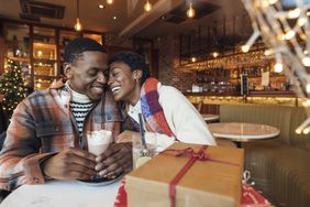 A couple next to a gift