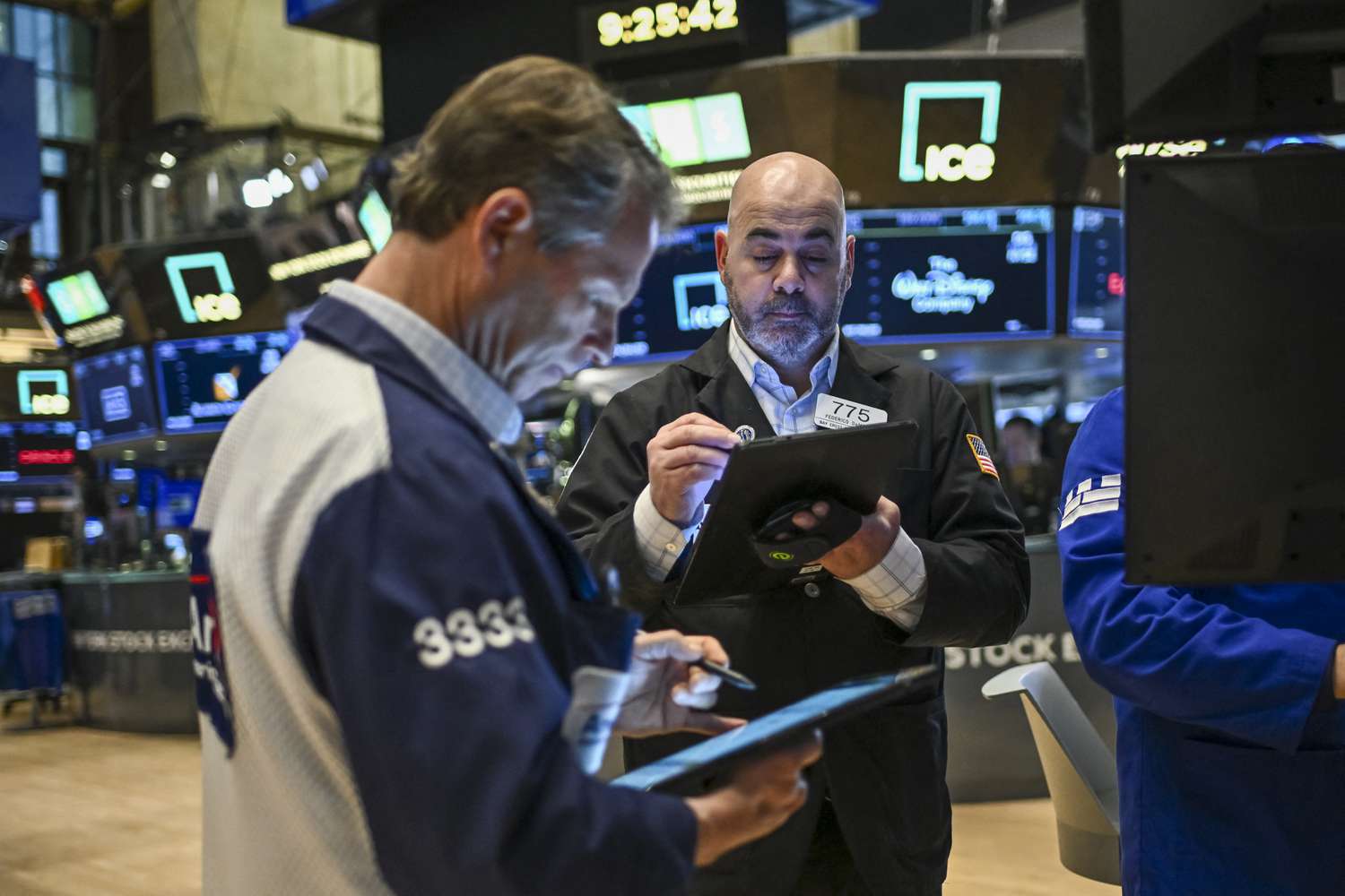 Traders work on the floor of the New York Stock Exchange