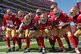 San Francisco 49ers' Fred Warner (54) and teammates celebrate Warner's interception return for a touchdown in 2nd quarter against New England Patriots during NFL game at Levi's Stadium in Santa Clara, Calif., on September 29, 2024