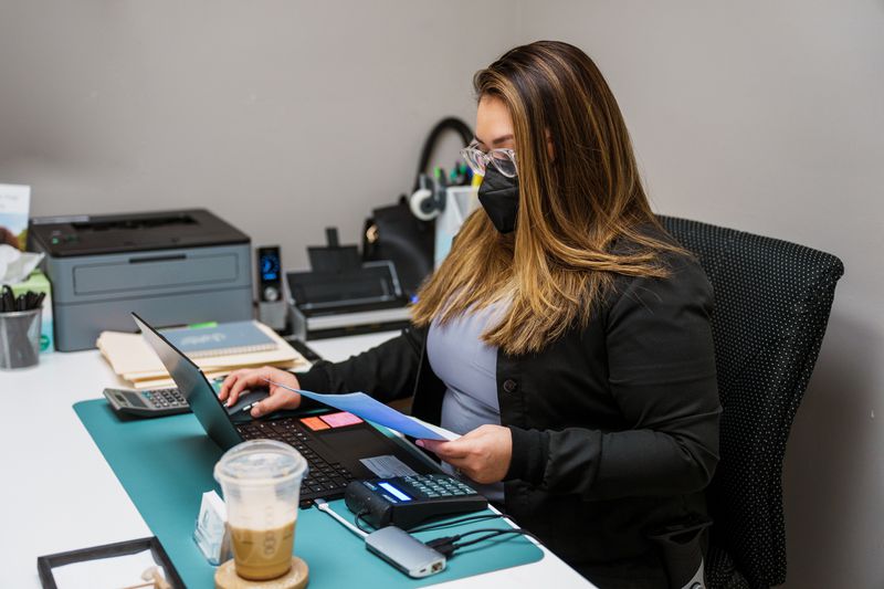 Dental clerk working on insurance paperwork