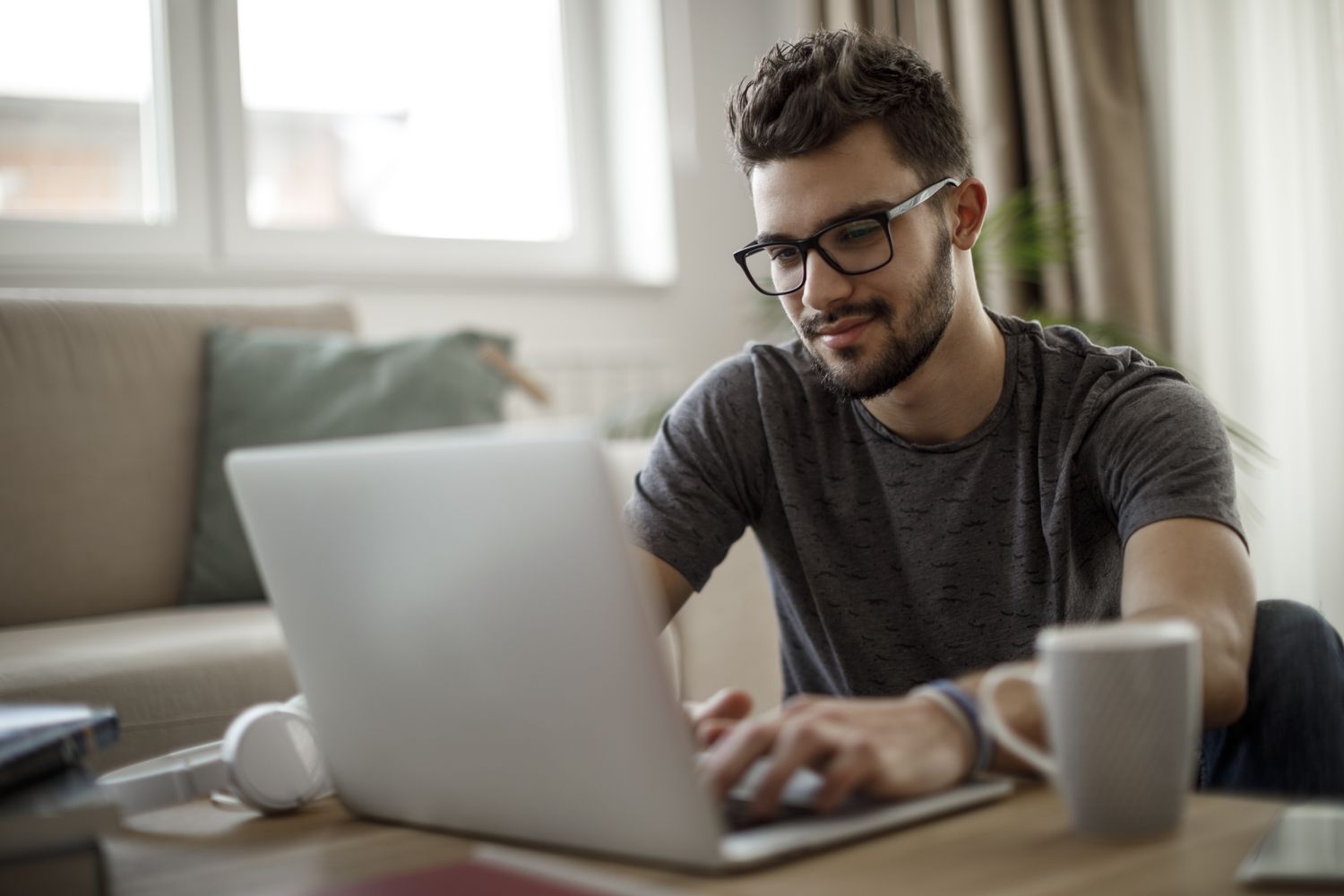 A young man using a laptop 
