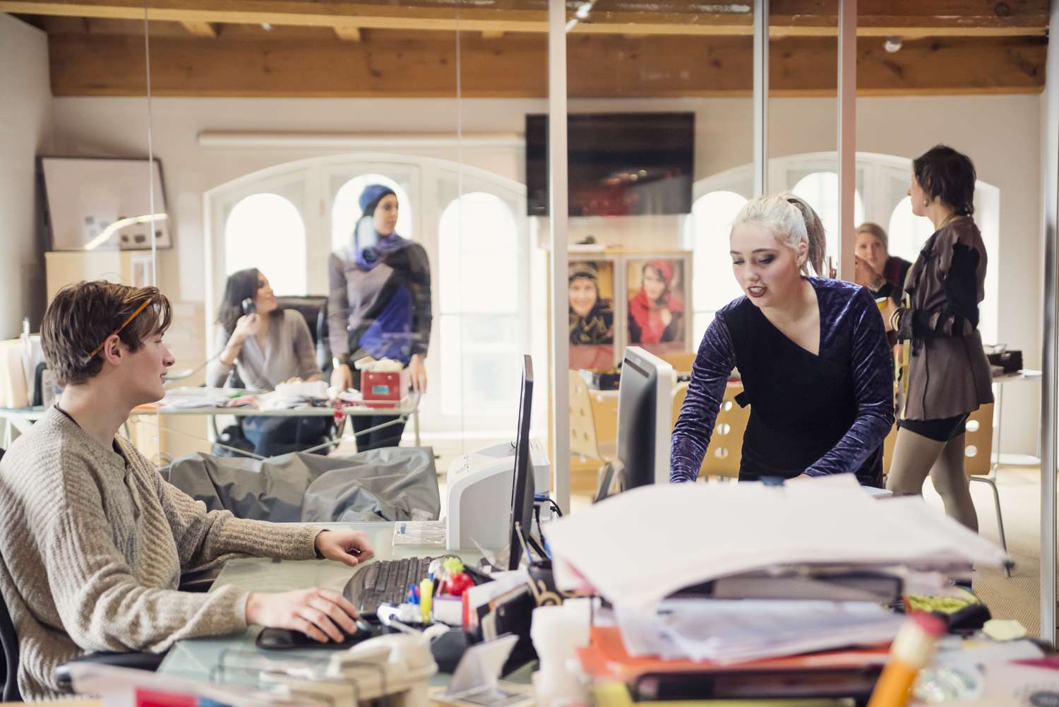 People working in a small creative firm