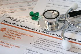 Closeup of a health insurance marketplace application with a stethoscope on top