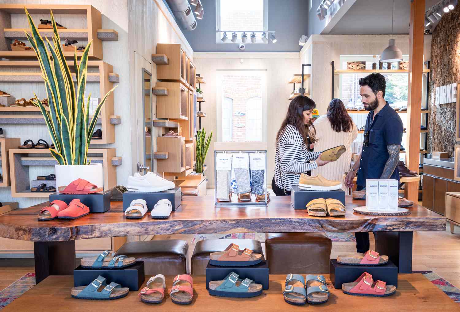 Customers shop at a Birkenstock store on October 10, 2023 in Venice, California.