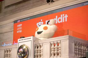 Reddit mascot rings the NYSE opening bell.