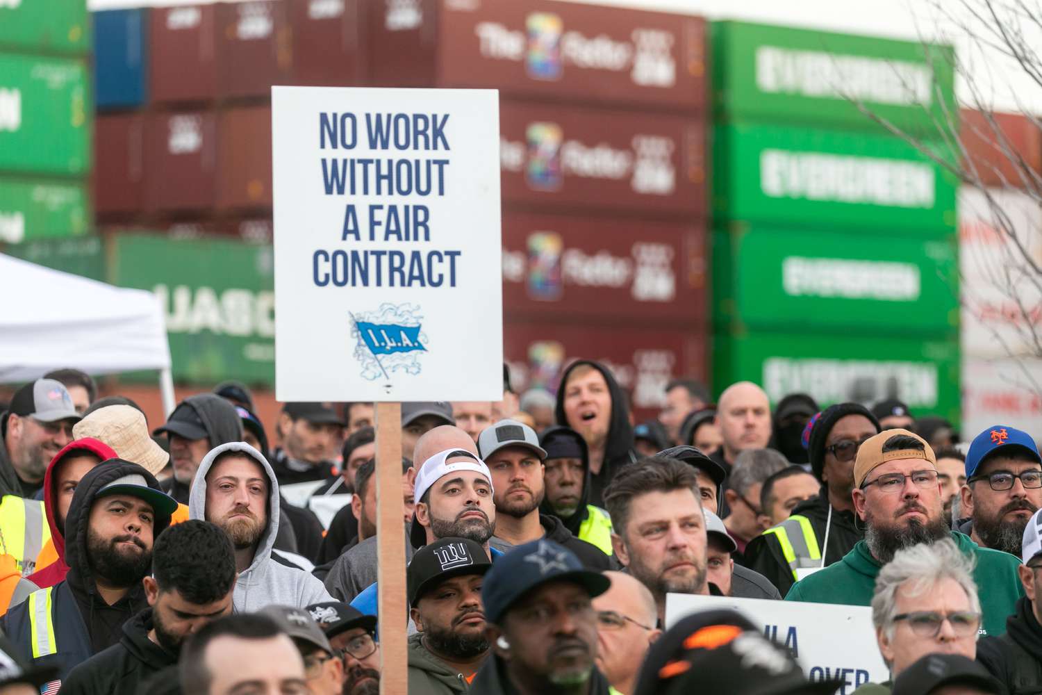 Workers picket outside of the APM container terminal at the Port of Newark in Newark, New Jersey, US, on Tuesday, Oct. 1, 2024. 