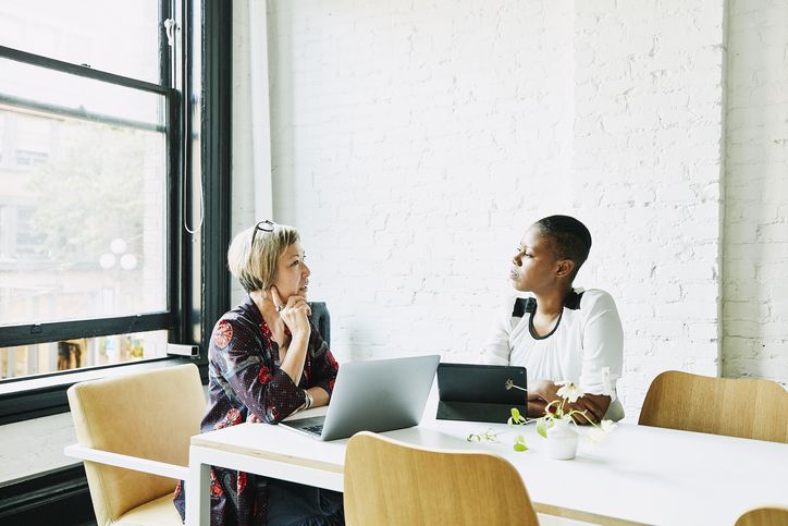 Women discussing something in an office