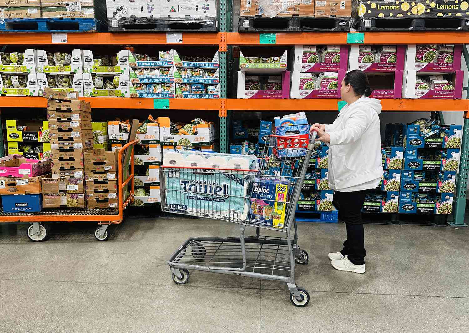 A woman shops for items at a Costco store.