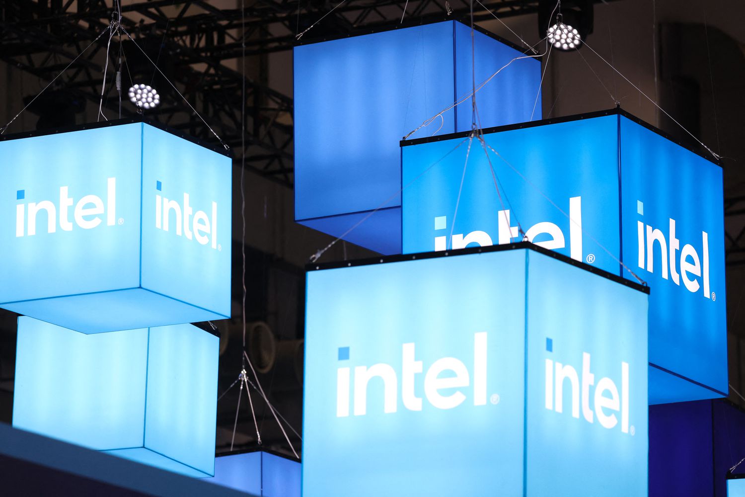 Intel logos on hanging displays at an event in 2024. 