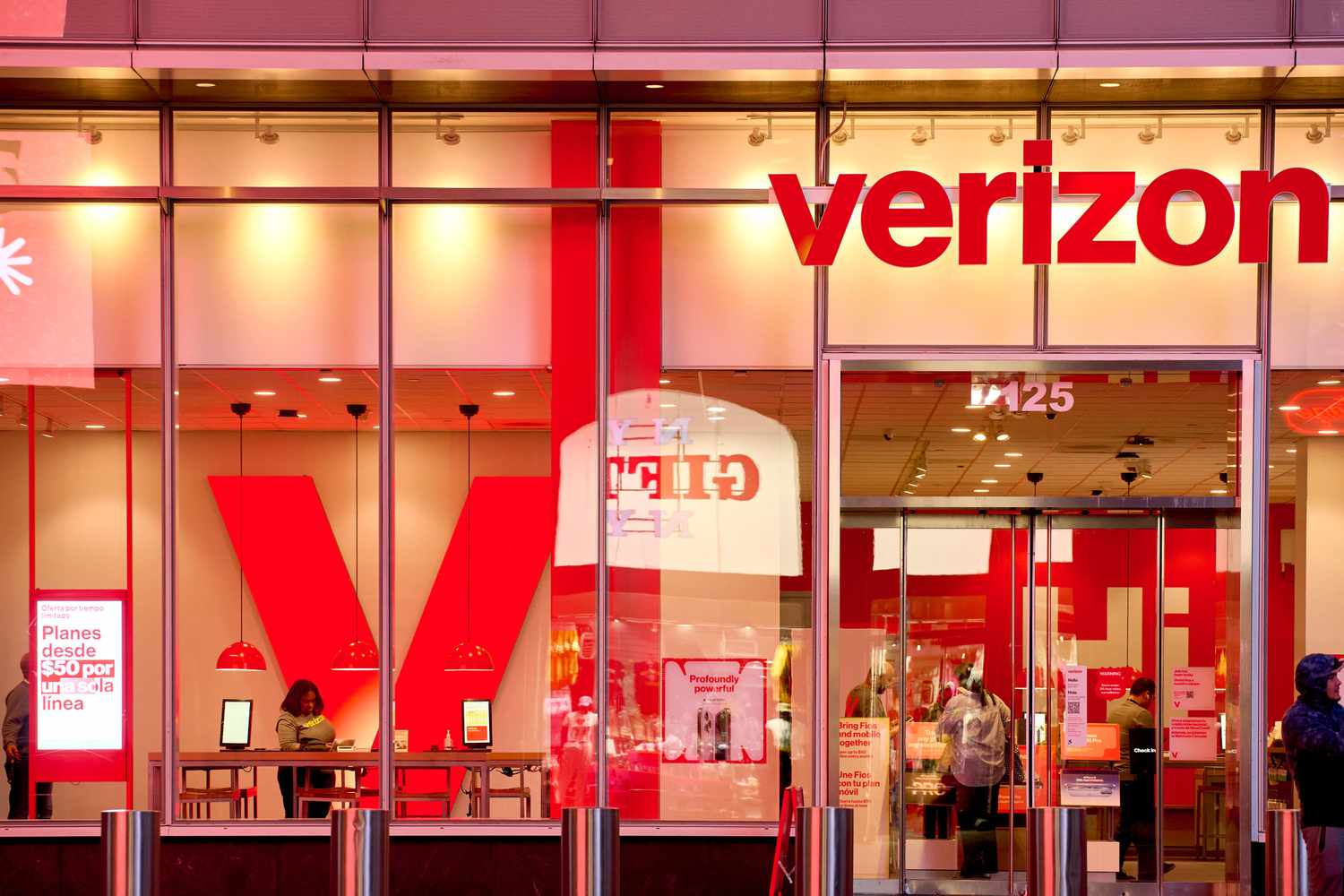 A Verizon store in New York City with a large red "V" on the left wall.