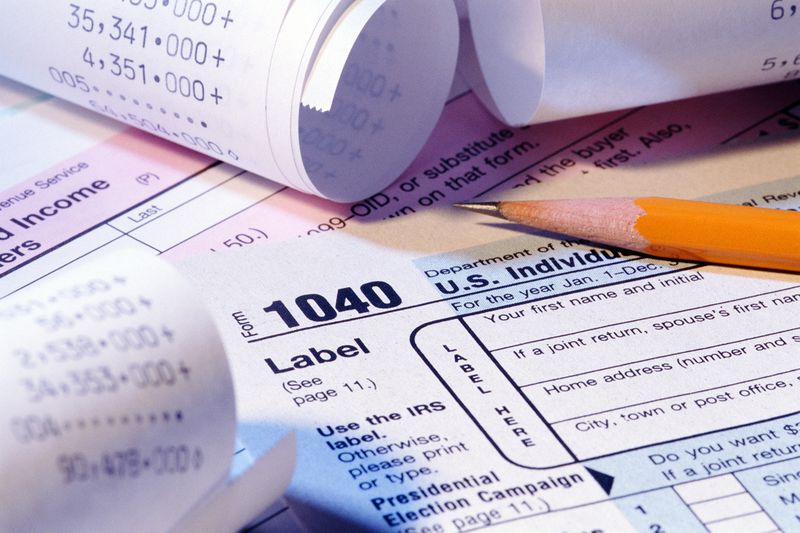 Tax Forms, Pencil, and Receipts