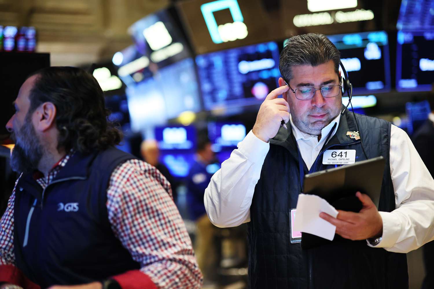 Traders work on the floor of the New York Stock Exchange