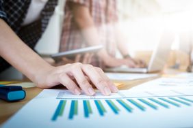 Close-Up Of Hand Of Business Analyst