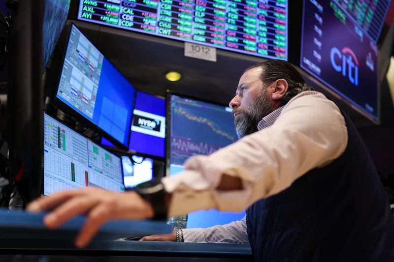 Trader works on the floor of the New York Stock Exchange