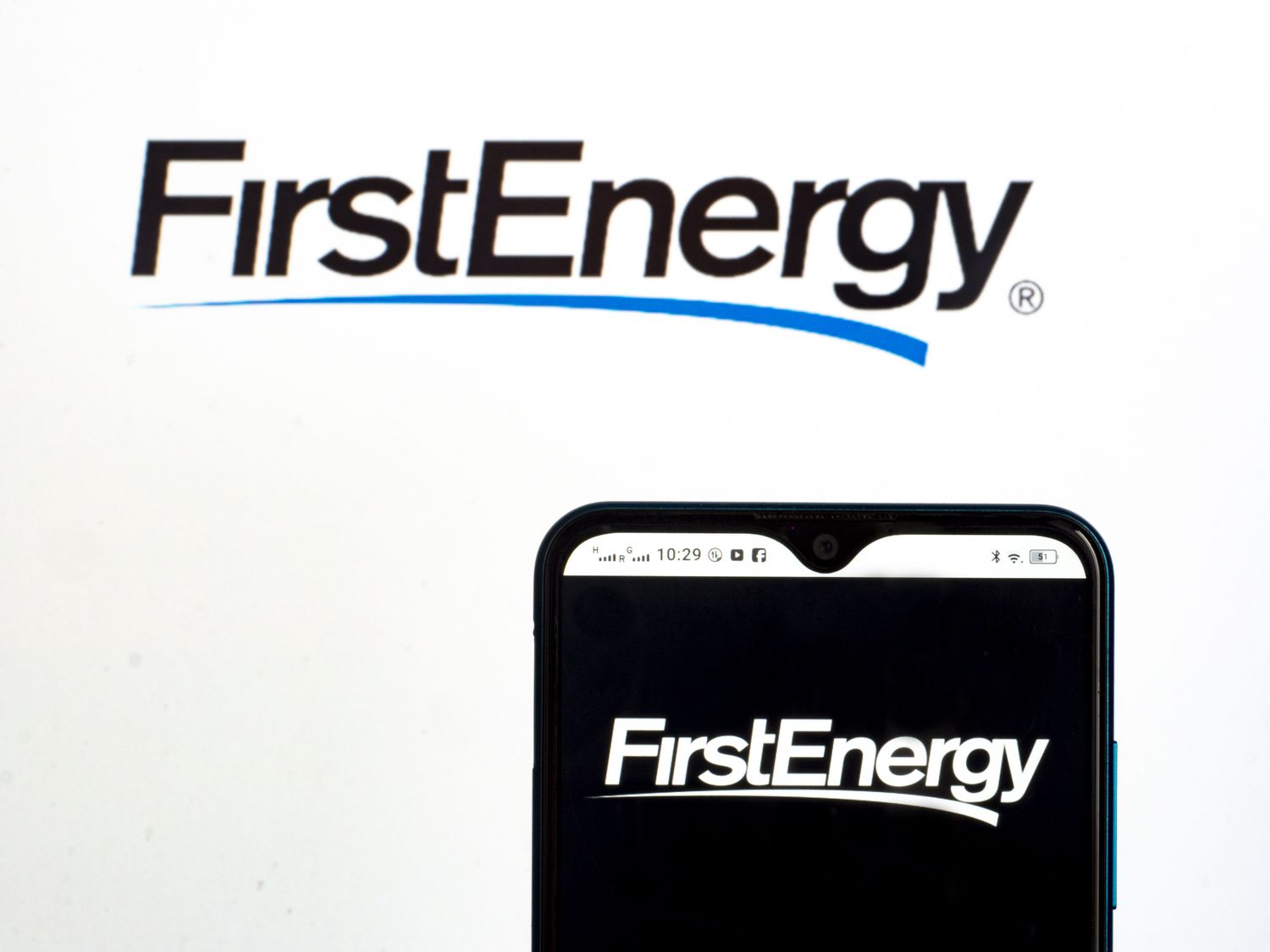 A pair of screens display the FirstEnergy logo.