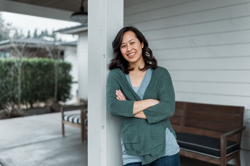 Woman standing on her porch