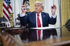 President Donald J Trump, with singer Kid Rock by his side, speaks to reporters and signs an executive order about enforcement in the concert and entertainment industry, in the Oval Office at the White House on Monday, March 31, 2025 in Washington, DC.