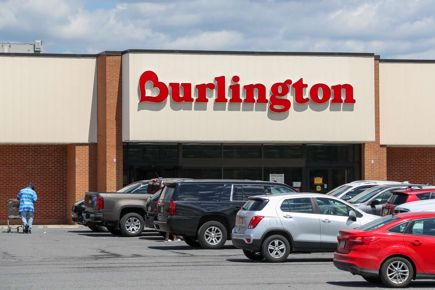 Cars and people are seen outside a Burlington store.