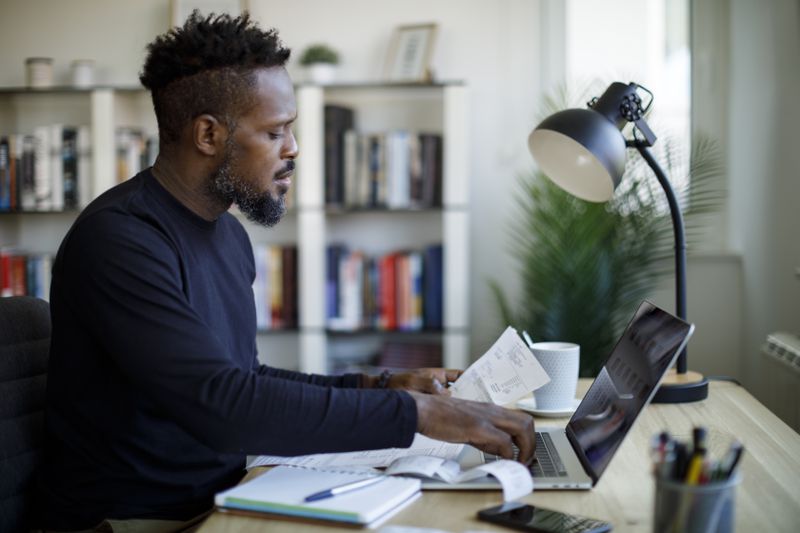person calculating budget and finances
