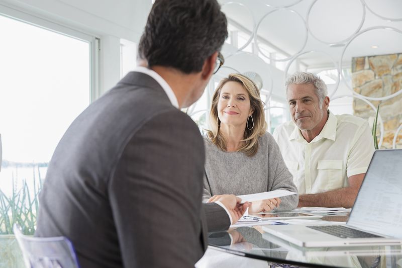 Couple talking to financial advisor