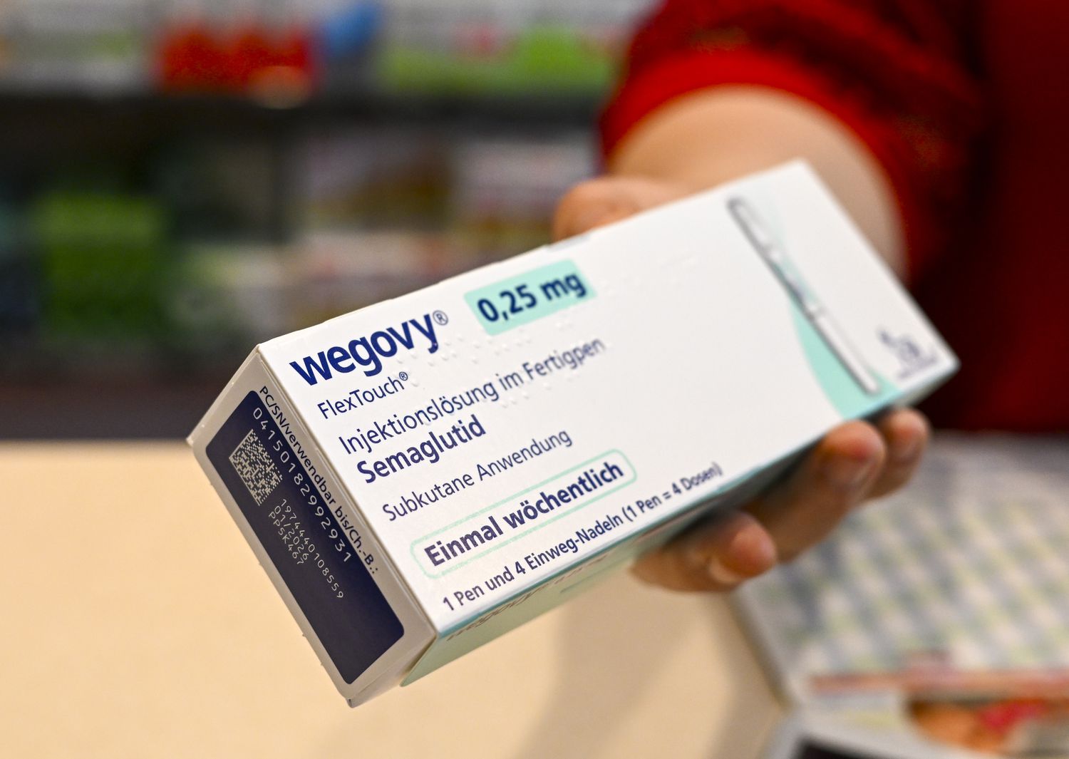 Wegovy box held in hand.