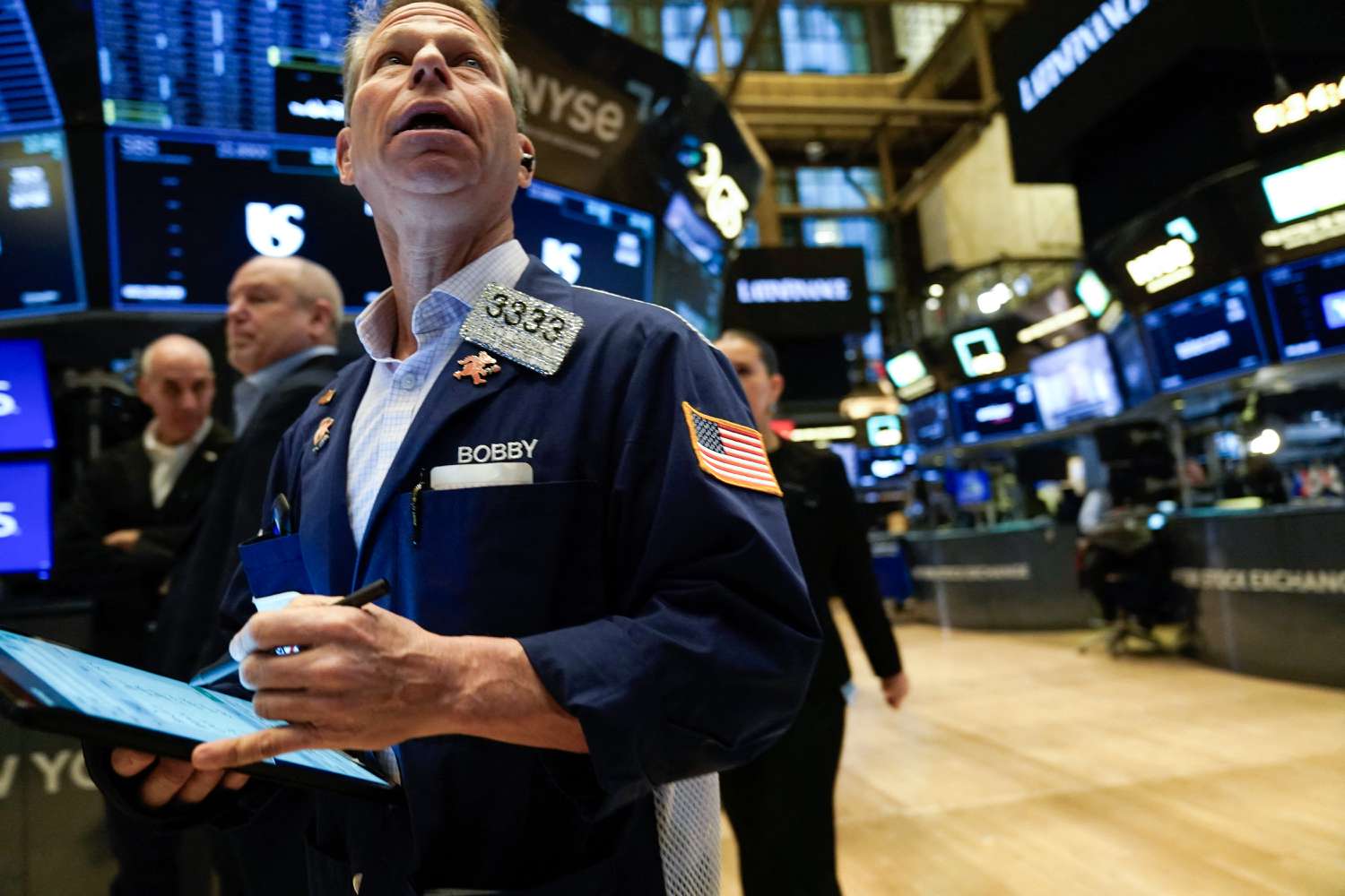 Traders work on the floor of the New York Stock Exchange (NYSE)